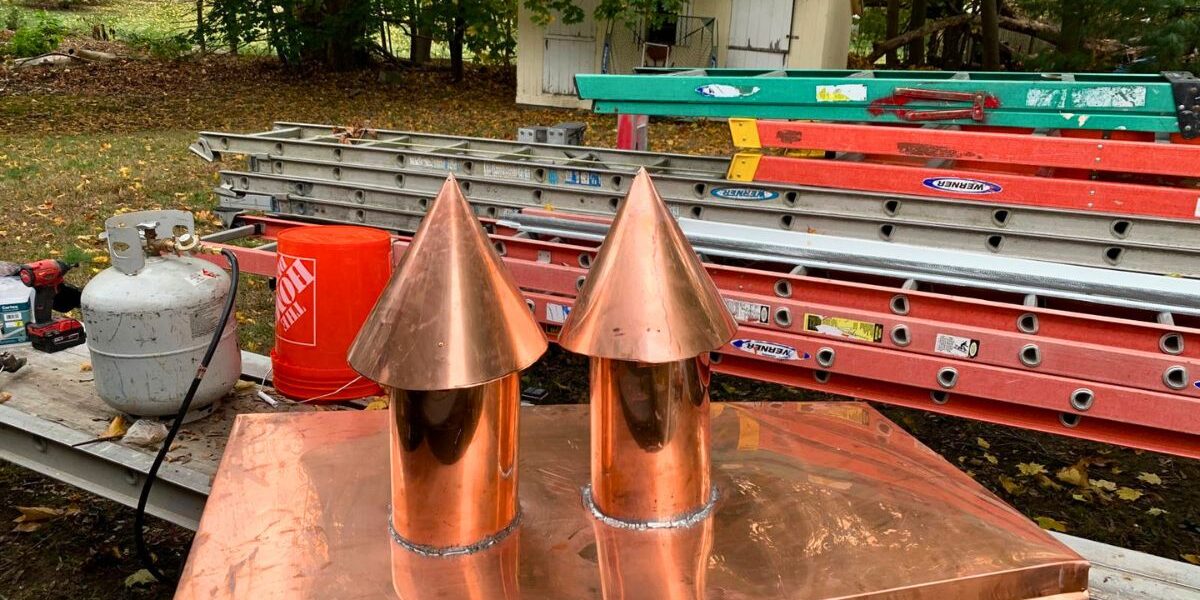 Custom handcrafted copper chimney caps and roof flashing detail by Luminous Construction in Wayland MA