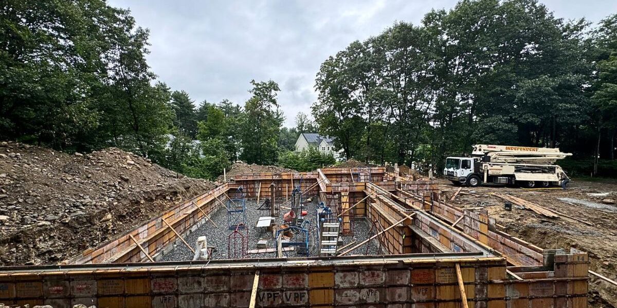 Concrete foundation forms and site preparation for structural home addition by general contractor in Ashland MA