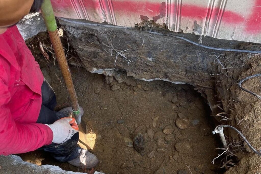 Manual subgrade excavation and foundation footing reinforcement for residential masonry in Natick MA