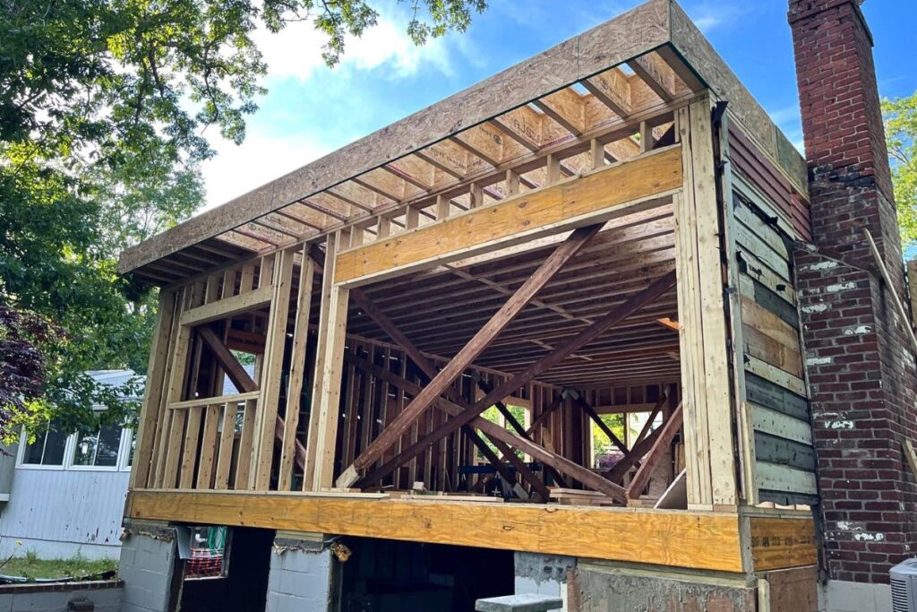 Structural wood framing and beam integration for custom home addition in Natick MA