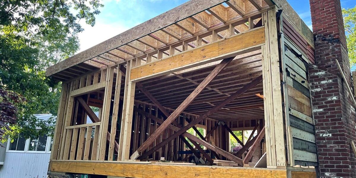 Engineered wood framing and beam integration for structural room addition in Southborough MA